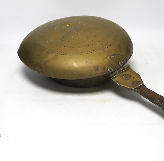 A 17th century brass and iron warming pan, 112cm. Condition - poor